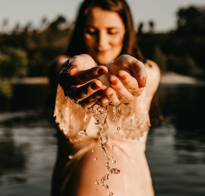 Photo Of Pregnant Woman Holding Water